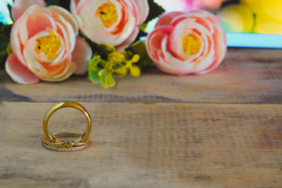 High angle view of wedding rings on table