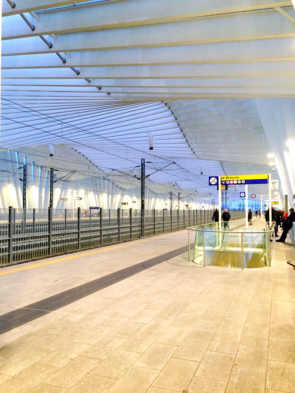 built structure, lifestyles, men, architecture, person, the way forward, large group of people, leisure activity, incidental people, sky, walking, railroad station platform, railing, transportation, ceiling, railroad station, pattern, travel, empty