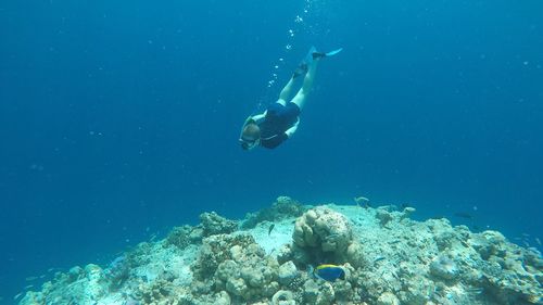 Young man swimming in sea