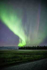 Scenic view of swamp against sky at night