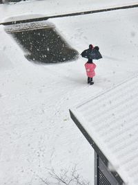 High angle view of people skiing on snow