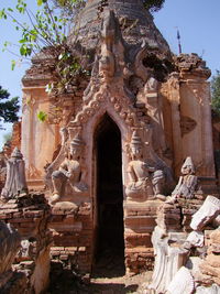 Statue against trees