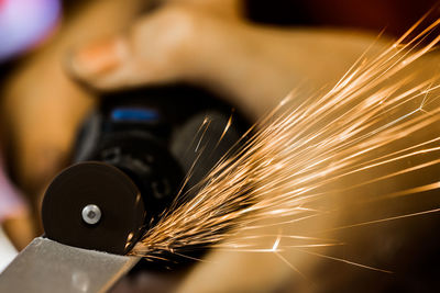 Low angle view of person working at factory