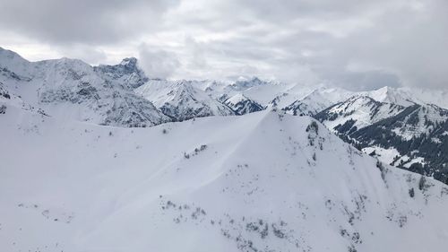 Scenic view of snowcapped mountains against sky