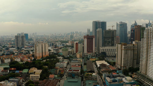 Skyscrapers and business centers in a big city manila top view. modern metropolis in asia, top view.