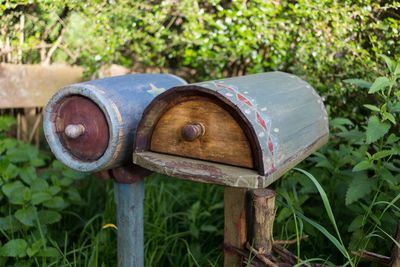 Close-up of old mail box on field in hobbiton