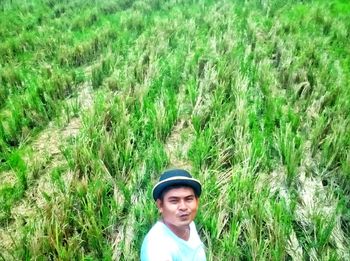 Portrait of man standing on field