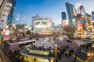 Panoramic view of crowd on road in city