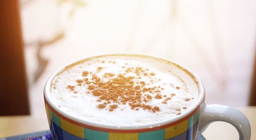 Close-up of cappuccino on table