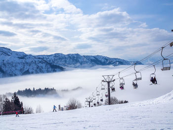 Scenic view of snow covered mountains against sky