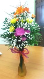 Close-up of flower vase on table at home