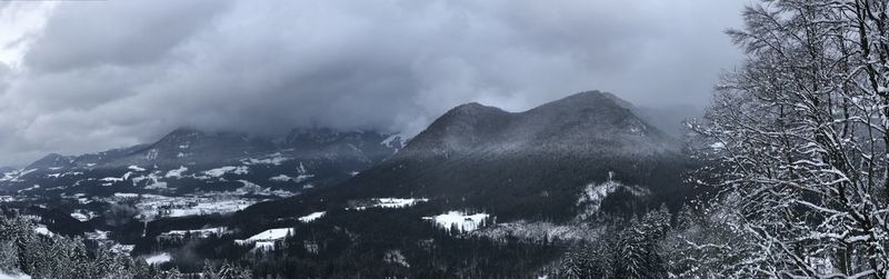 Panoramic shot of trees and mountains against sky