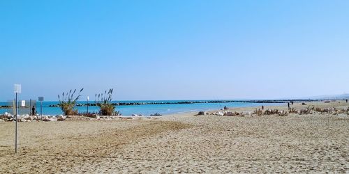 Scenic view of beach against clear sky