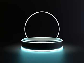 Close-up of illuminated lamp against black background