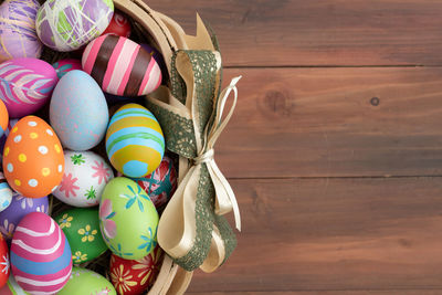High angle view of multi colored eggs on table