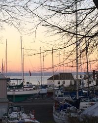 Boat in sea at sunset