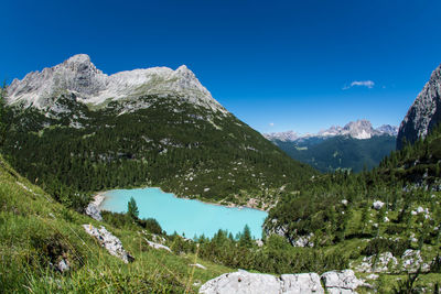 Scenic view of mountains against clear blue sky