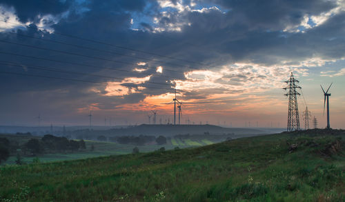 Scenic view of field against sky during sunset