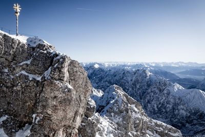 Scenic view of snowcapped mountains against clear sky