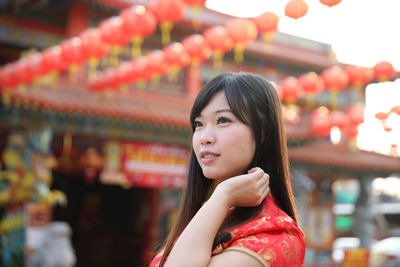 Portrait of young woman looking away