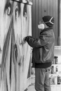 Portrait of man standing at home