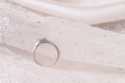 High angle view of wedding rings on floor