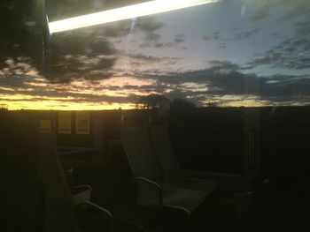 Scenic view of sunset seen through window