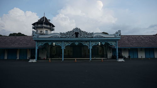 Building against cloudy sky