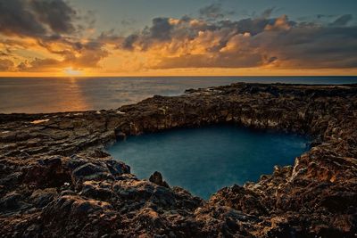 Scenic view of sea against sky during sunset