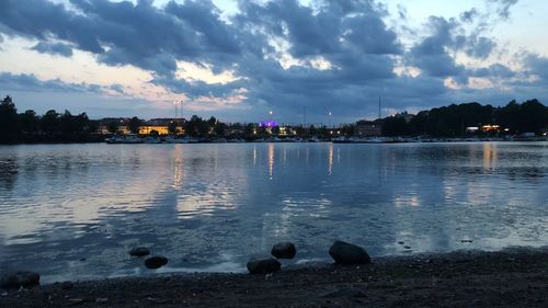 Scenic view of lake against sky at sunset