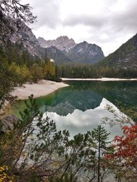 Scenic view of lake and mountains against sky