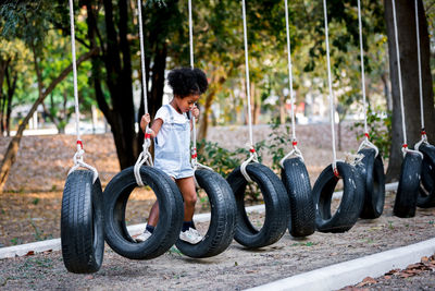 Full length of girl playing in playground