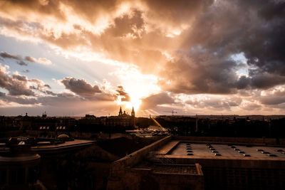 High angle view of buildings against sky during sunset