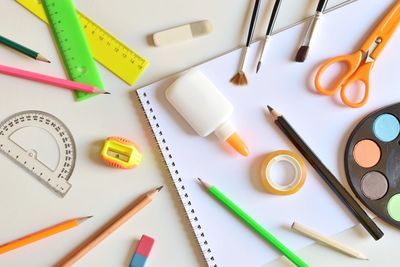 Directly above shot of various school supplies on table