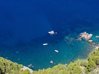 High angle view of sailboats on sea shore