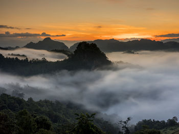 Scenic view of mountains against sky during sunset