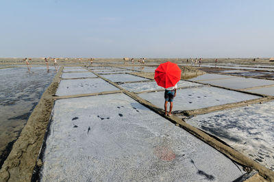 Full length of woman on railing