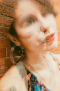 Close-up portrait of young woman looking away