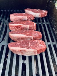 High angle view of meat on barbecue grill