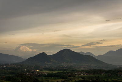 Scenic view of mountains against dramatic sky