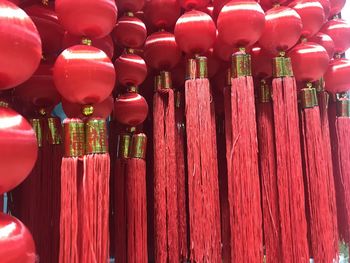 Low angle view of decorations hanging in row