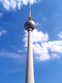 Low angle view of communications tower against sky