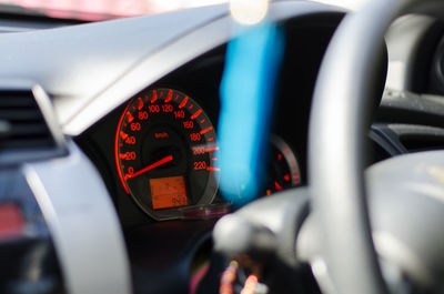 Close-up of illuminated speedometer of car