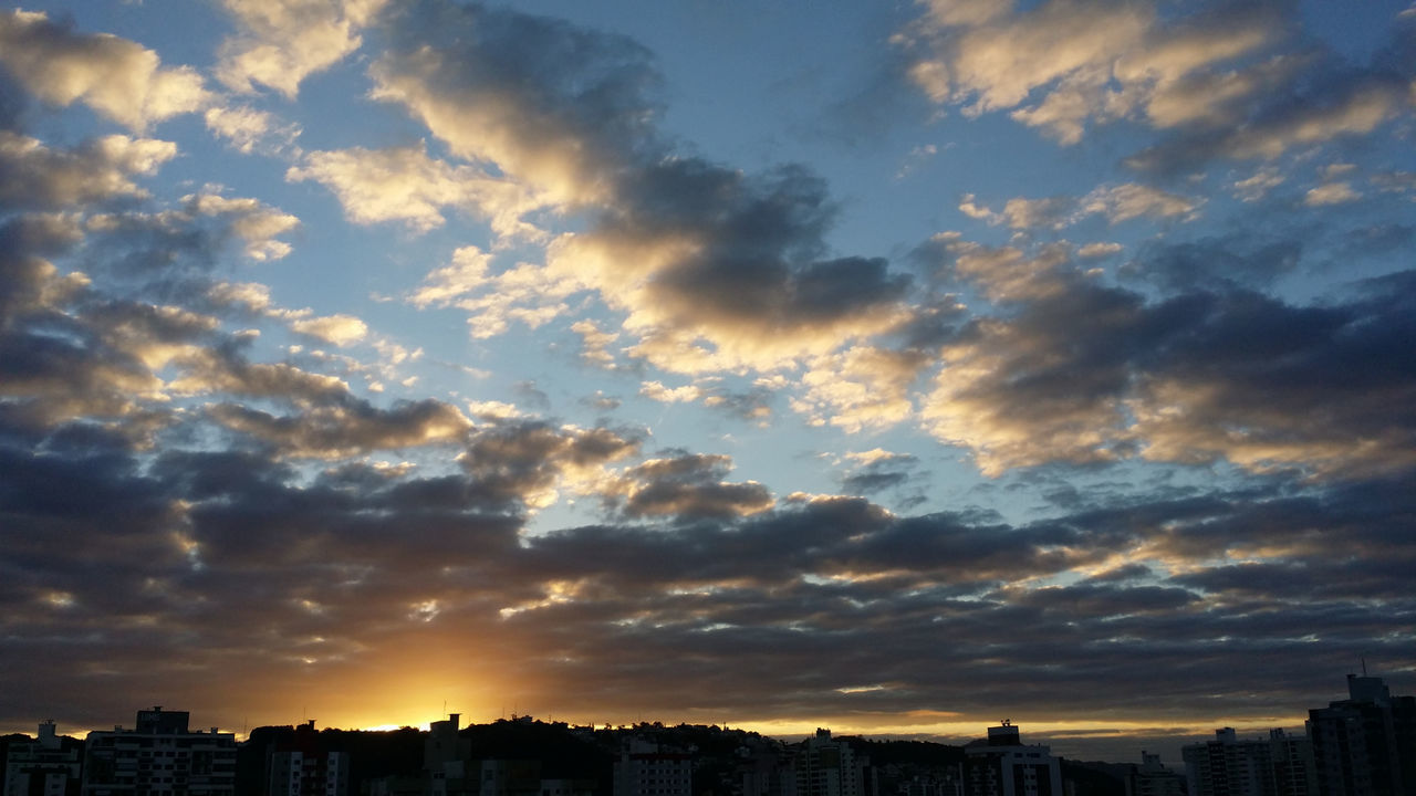 sky, cloud - sky, architecture, building exterior, sunset, built structure, city, building, cityscape, nature, beauty in nature, no people, scenics - nature, orange color, outdoors, office building exterior, landscape, skyscraper, urban skyline, dramatic sky