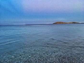 Scenic view of sea against blue sky