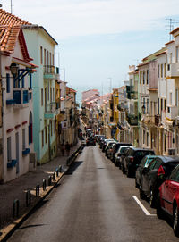 Road in city against sky