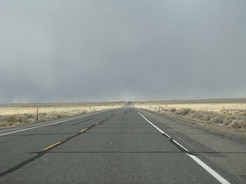 Empty road along landscape