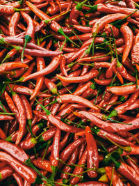 Full frame shot of red chili peppers for sale in market