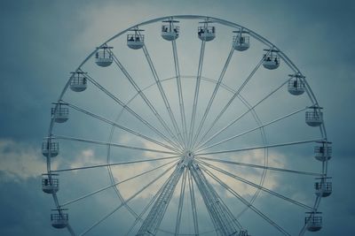 Low angle view of ferris wheel against sky