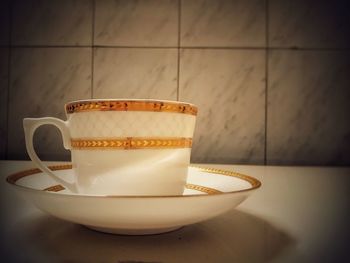 Close-up of coffee cup on table